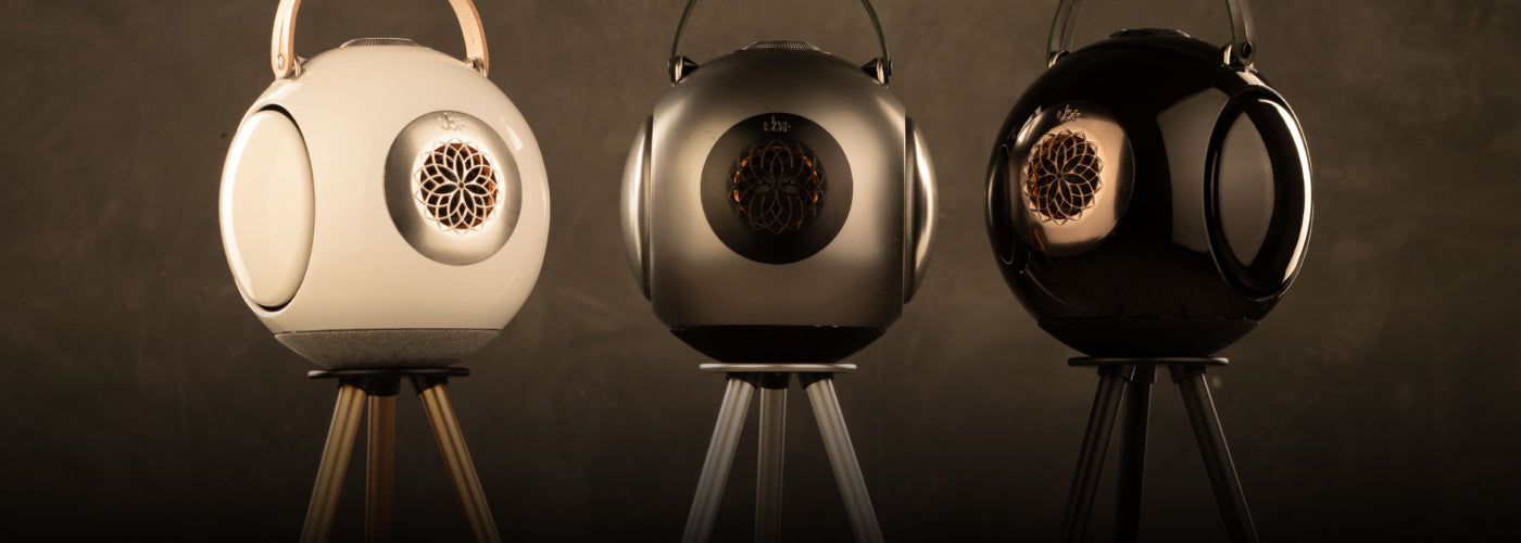 UB+ dB1 doubleBASS lineup sphere-shaped portable bluetooth speakers in three colors on a tripod
