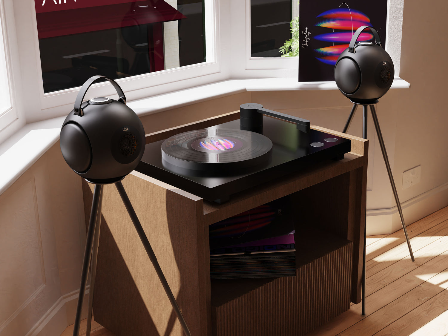UB+ DB1 Doublebass Circle round portable bluetooth speaker on a tripod next to a record player